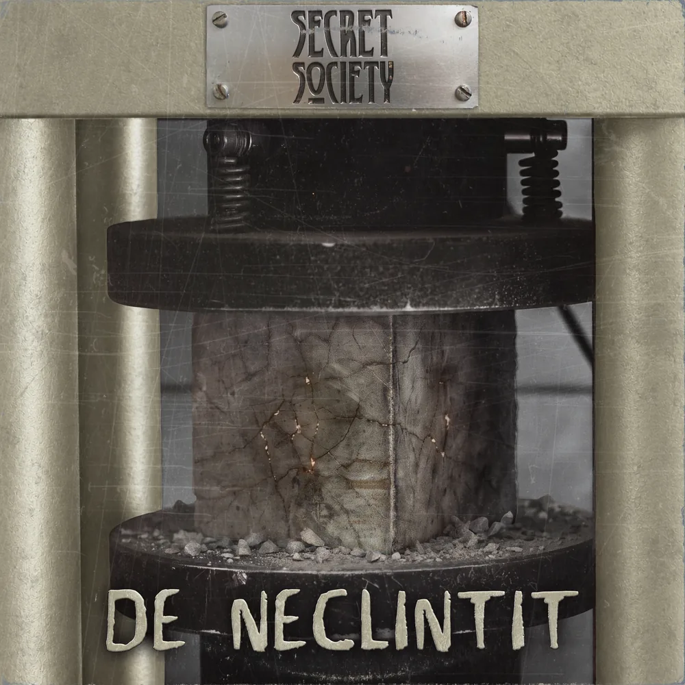 De Neclintit cover: a stone block in a bone-white hydraulic press